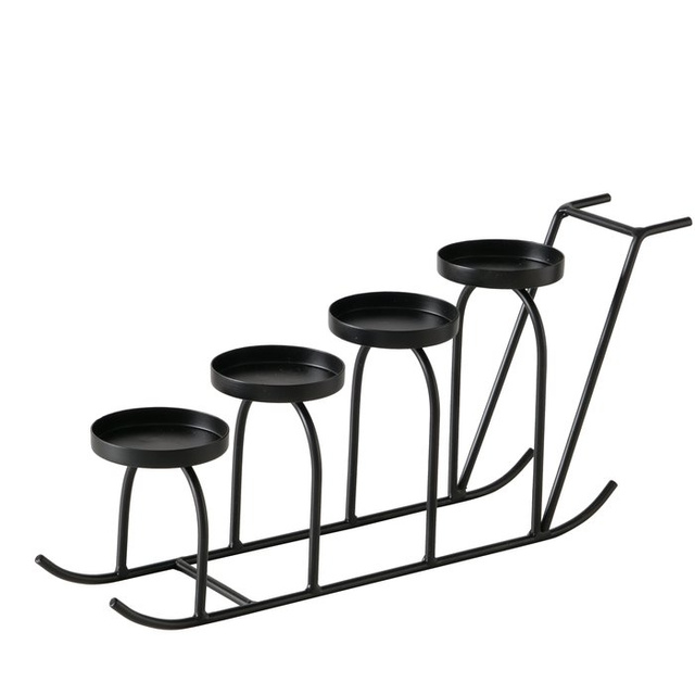 Candelabru metalic în formă de sanie SLIDO